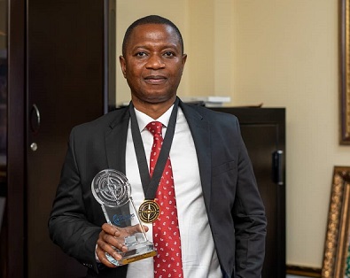 • Mr Adjei displaying the award