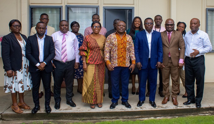 Mr Joseph Cudjoe ( fifth from left), Mr Martin Adu-Owusu (third from right) with management members of NTC and Public Enterprises after the meeting