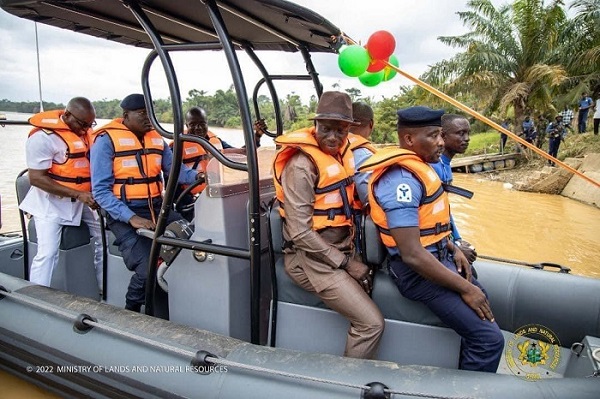 • A naval team patrolling the river Pra in the company of Samuel A. Jinapor, Minister of Lands and Natural Resources