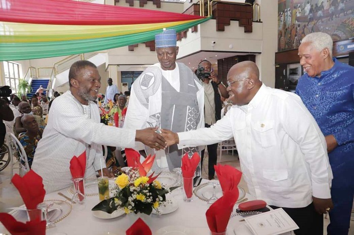 President Akufo-Addo (right) exchanging pleasantries with some of the old citizens at a lunch to mark the Founders Day in Accra