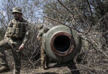 Ukrainian soldiers prepare artillery at the southern frontline near Kherson