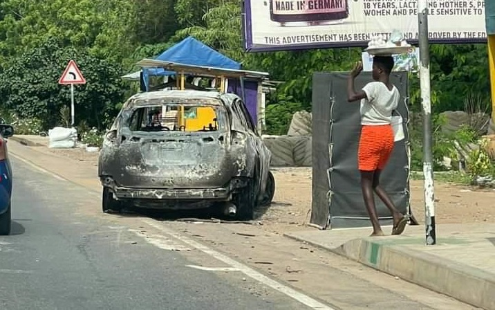 • The car set ablaze during the clash
