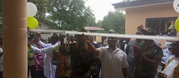 Brigadier General Barimah Boako Owusu(Left) and Mr Issaka (right) cutting the tape to the Summer hut
