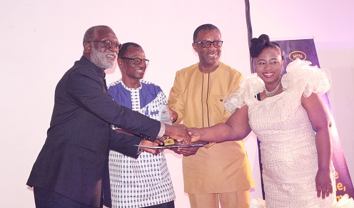 • Team officials from the global impact foundation receiving their award at the ceremony Photo: Ebo Gorman