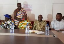Mr. Ntim, (seated second from right), with Nana Opagyakotwere BonsraAfriyie II, middle, Adansihene and Mr. Eric Kusi, right, Adansi North District Chief Executive during his visit to the Adansi North District Assembly.
