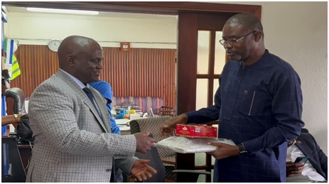 • Dr Braimah (right) presenting some items to the MD of GVWC, MaadaKpenge