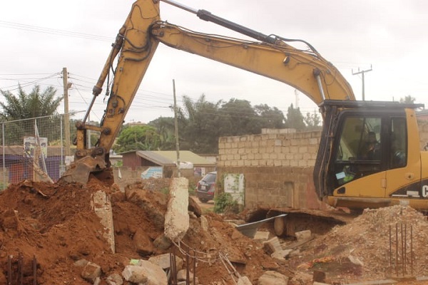 • Excavator demolishing some of the structures