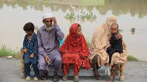 • Displaced people wait for relief at a flooded area in the Charsadda District, Khyber Pakhtunkhwa province
