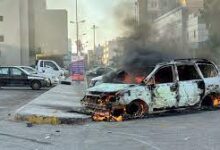 • A damaged vehicle in Tripoli on Saturday
