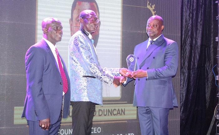 Prof. Samuel Ato Duncan (middle) receiving an award from Mr Thomas Mbomba,Deputy Foreign Affairs Minister. Photo. Ebo Gorman.