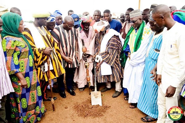 • Mr Tampuli (third left) being assisted by the regent of Gusheigu, Abdulai Mahamudu Shitobu to cut the sod.