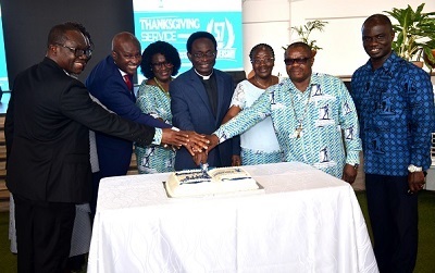 Apostle Prof. Opoku Onyinah(middle)with Rev Dr Ampia Kwof(third from left)and Rt. Rev. Dr. Sylvanus D. Torto(second from right)with other officials cutting the anniversary cake.