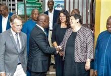 Samuel Abu Jinapor (2nd from left), Minister of Lands and Natural Resources, in a handshake with Virginia E. Palmer, US Ambassador, while Edward Case (left), the Leader of the US delegation, looks on