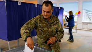 A service member of the self-proclaimed Donetsk People's Republic casts his vote