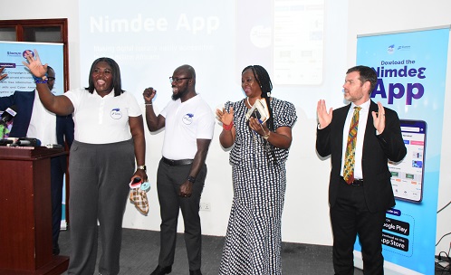 Mrs Francisca Boateng (left) and other development partners launching the App