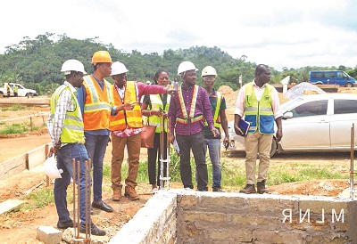 Mr Owusu-Bio and members of the Committee inspecting the progress of work at Appiatse