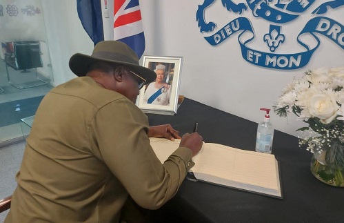 Nii Ashietey signing the book of condolence
