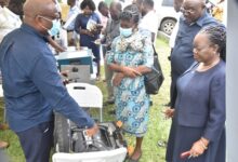 Mr Godfred Saviour Adzaglo,(left) Environmental Quality Department, EPA explaining to Mrs Cynthia Asare-Bediako(right) and other guests on some equipment. Photo Godwin Ofosu-Acheampong
