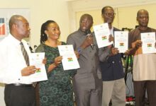 Dr Mohammed Amin Adam (middle),Dr Steve Manteaw (right) and other dignitaries launching the report. Photo. Ebo Gorman