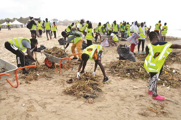 The participants cleaning the garbage at the Laboma beach.Photo. Vincent Dzatse