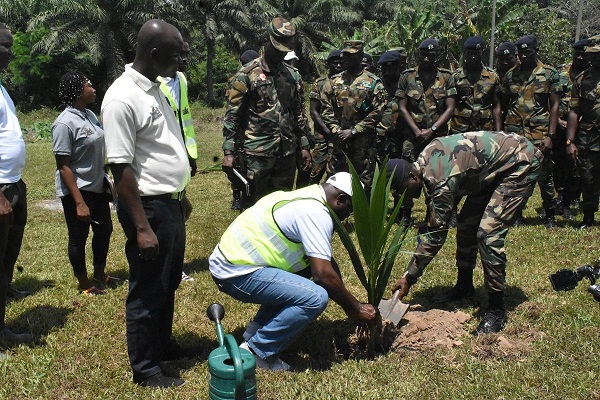Mr Abdul Mumin and Lt. Col. Daniel Atobrah Bondahand Mr Jointly planting a coconut seedling