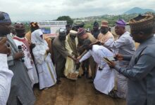 The National Chief Imam (middle) cutting the sod