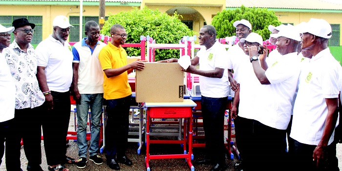 • Mr John Gerald Essel (fourth from right), Chairman, OSSA 1981 year group presenting the items to Mr Patrick Mensah,Headmaster,Odorgonno SHS. With them are members of the group. Photo: Ebo Gormanto