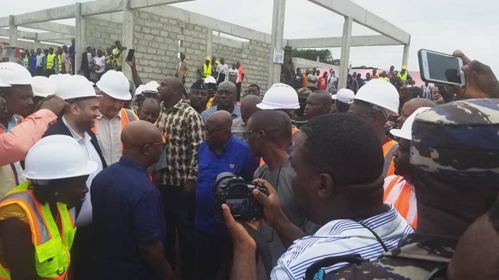 President Akufo-Addo (middle) interacting with some engineers during his tour