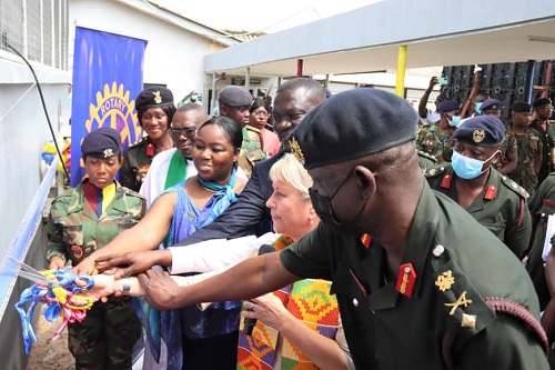 Jennifer Jones (2nd from right) assisted by Brig. Gen. Azumah, commander of the 37military to cut tape to inaugurate the renovated children’s wards