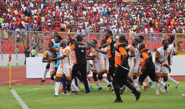 A stunned stadium looked on as Kadiogo players celebrate their win at the Baba Yara Sports Stadium yesterday