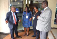 Mr Kweku Agyeman Manu(left) interacting with Ms Enyo Nudu(second from left),Dr Nii Hanson-Nortey(third from left) and Dr Baafuor Awuah (right) after the opening session of the programme