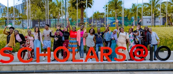 A group of Mastercard Foundation Scholars express excitement at the Baobab Summit 2022, in Kigali, Rwanda.