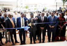 Mr. John Ntim Fordjour (third from left) assisted by Prof Abednego Amartey (third from right) and other digniteries to cut tape to open the facility Photo Geoffrey Buta
