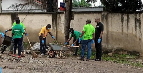 Mr Sackey in black (right) with staff in the clean-up.