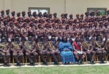 Mrs Eyiah (middle) with some of the directing staff of the POTS and some recruits after the passing out ceremony