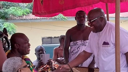 Mr Acheampong (right) exchanging pleasantries with Odeneho Kwafo Akoto III