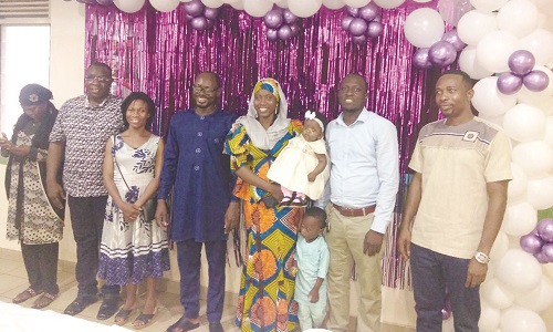 Madam Fayudatu Yakubu (holding a preterm child) flanked on the left by Professor Alhassan and Mr Domesie (right) at the launch