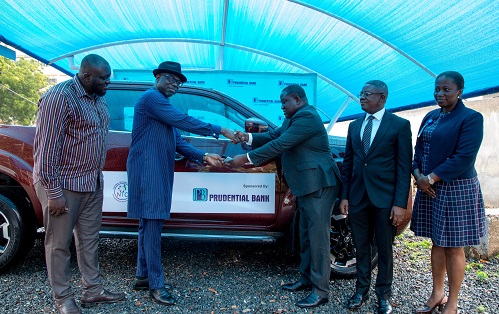 Mr Broni (third from right) handing over the keys to Dr Addai-Poku