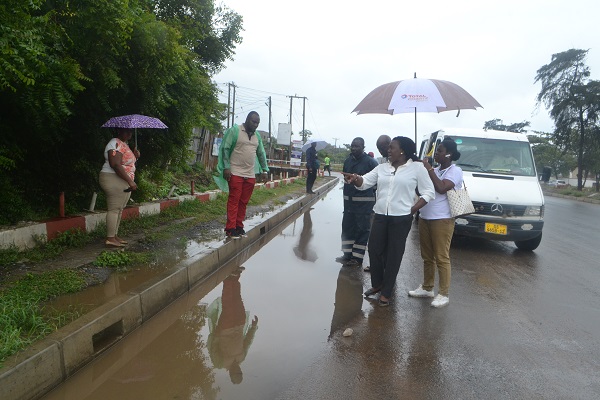 Ms Sowah (second from right) and others monitoring the road project Photo Victor A. Buxton