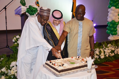 Mr Meshal Al Rogi(middle)with Mr Alban Sumana Bagbin(left) and Mr Frederic Obeng Adom cutting the anniversary cake. Photo. Vincent Dzatse