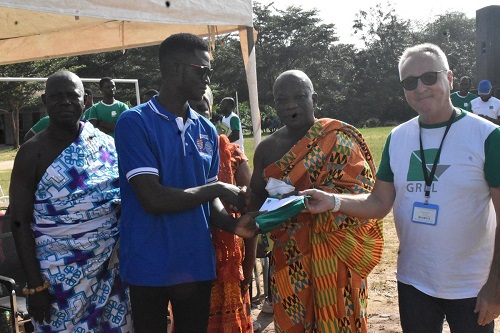 Mr Andrews Gyawu receiving a cheque from Mr Barre (right)
