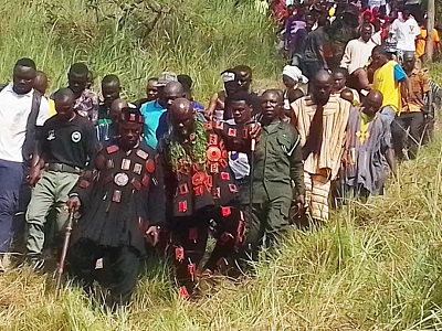 Nene Korabo(Second Right) and his people returning from the Hill after the rites.