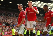 Anthony (left) being joined by teammates to celebrate United’s opening goal