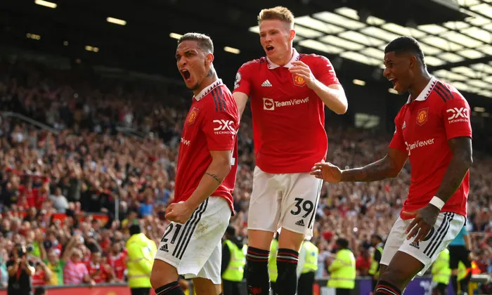 Anthony (left) being joined by teammates to celebrate United’s opening goal