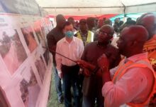 Dr Bawumia (second from right) observing some exhibits of the rehabilitated roads
