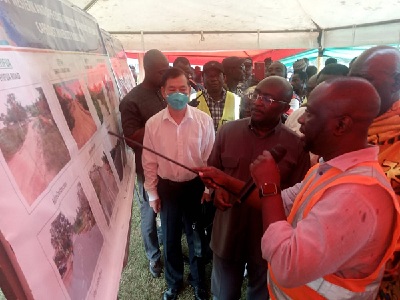 Dr Bawumia (second from right) observing some exhibits of the rehabilitated roads
