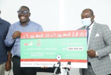 • Kurt Okraku (right) and Mr Takyi-Appiah displaying the dummy cheque at the event
