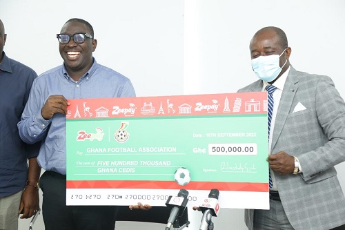 • Kurt Okraku (right) and Mr Takyi-Appiah displaying the dummy cheque at the event