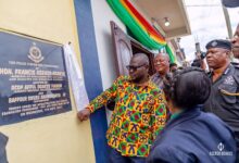 Inset;Mr Francis Asenso-Boakye (middle) unveiling a plaque to open the facility