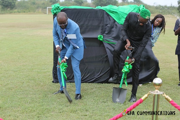 Okraku (left) and Ajibade breaking the ground for commencement of the project